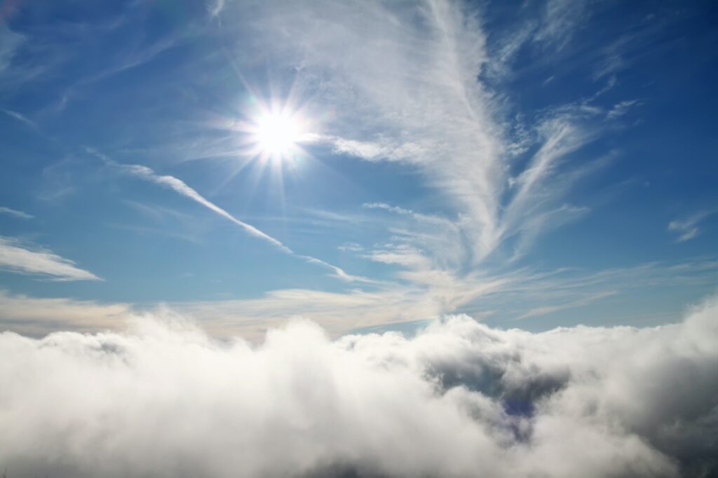 Blue sky sky with clouds and sun. Natural background concept