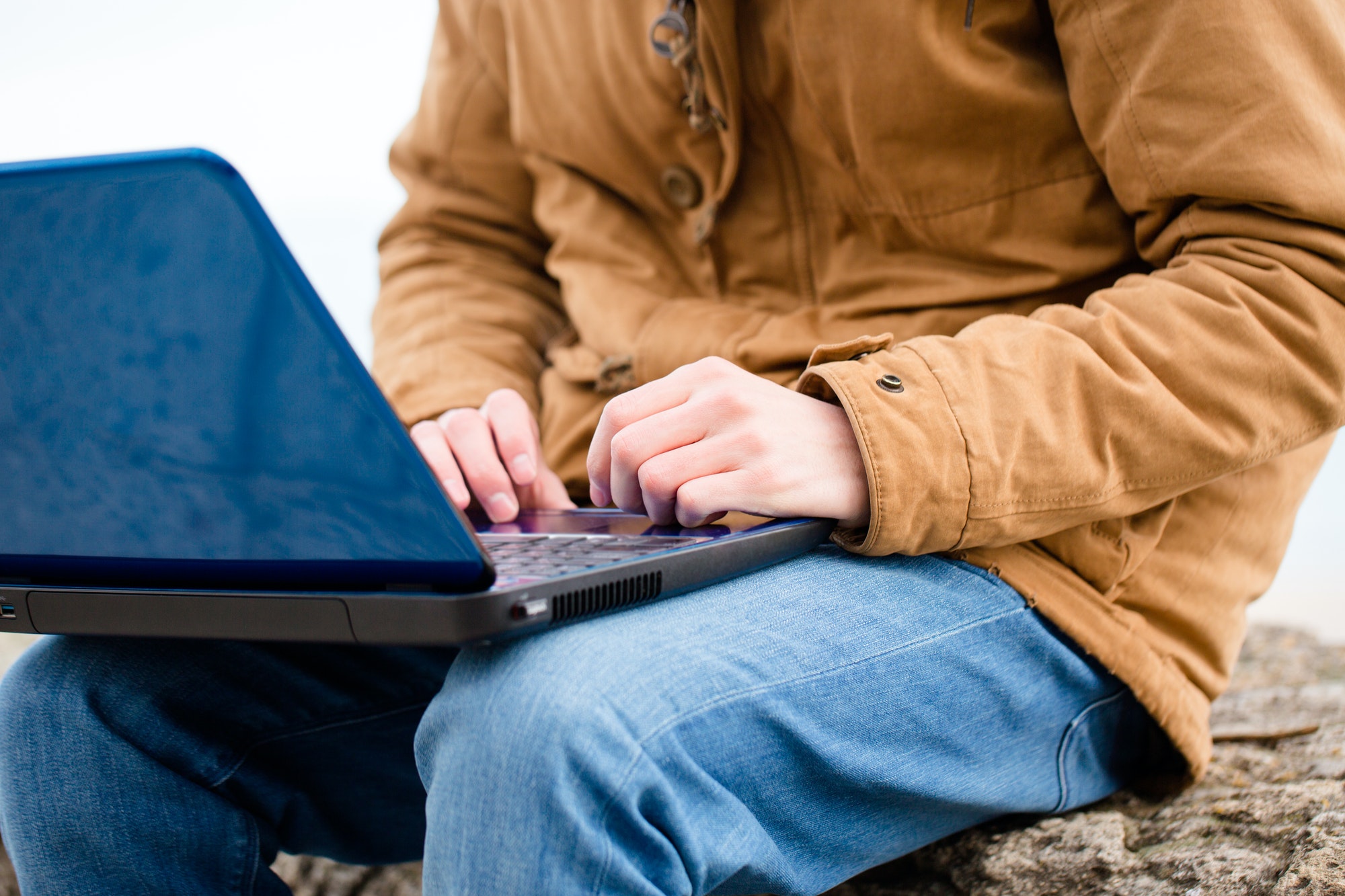 Casual man using laptop computer