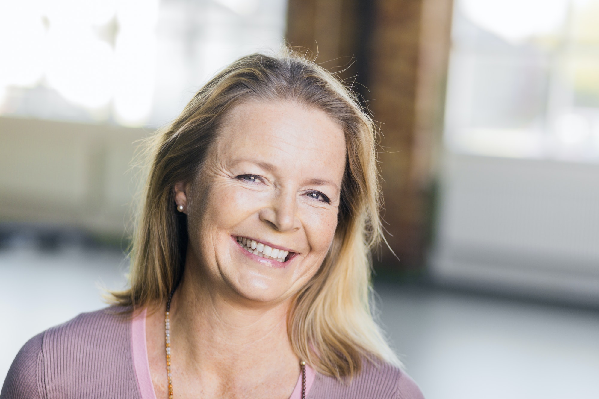 Portrait of mature woman smiling in gym