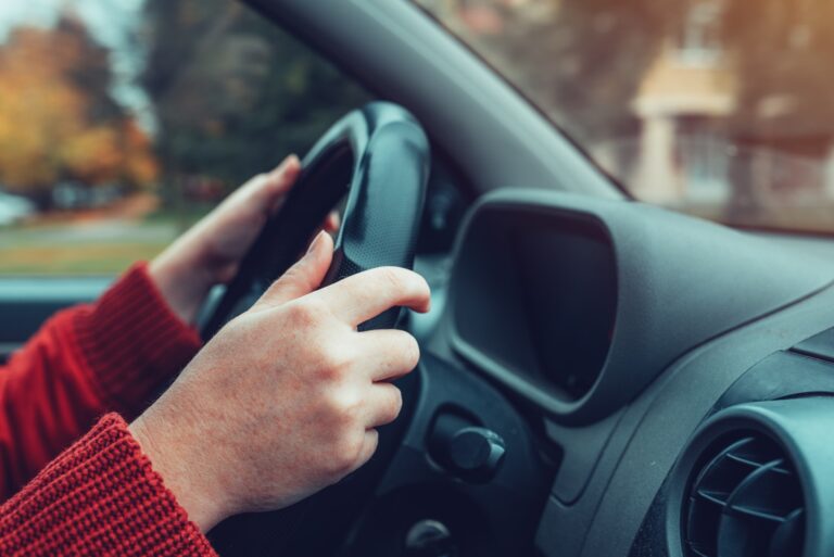 Driving car on street in autumn
