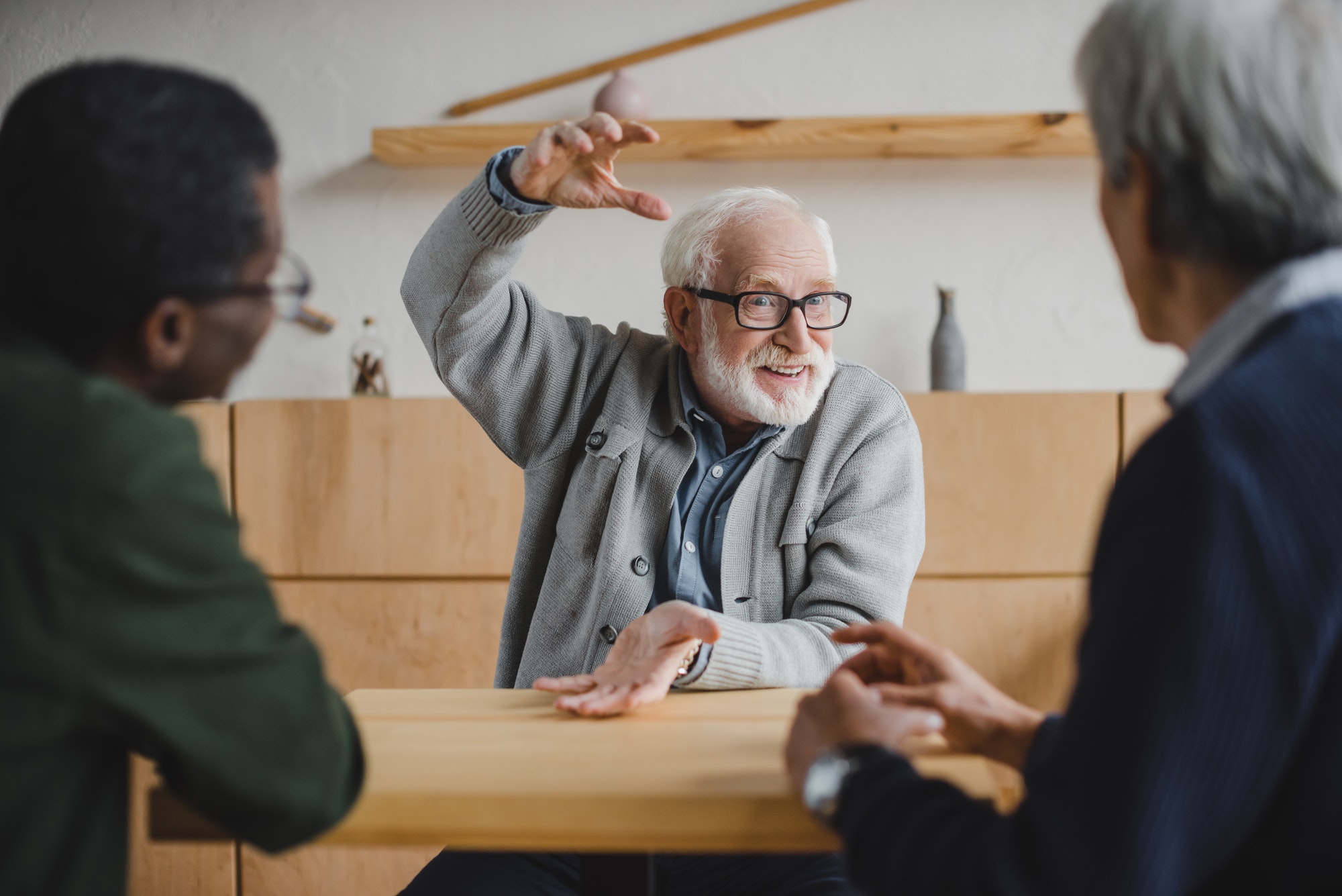 group of multiethnic senior friends sharing stories from past