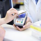 Close up of contactless payment at pharmacy